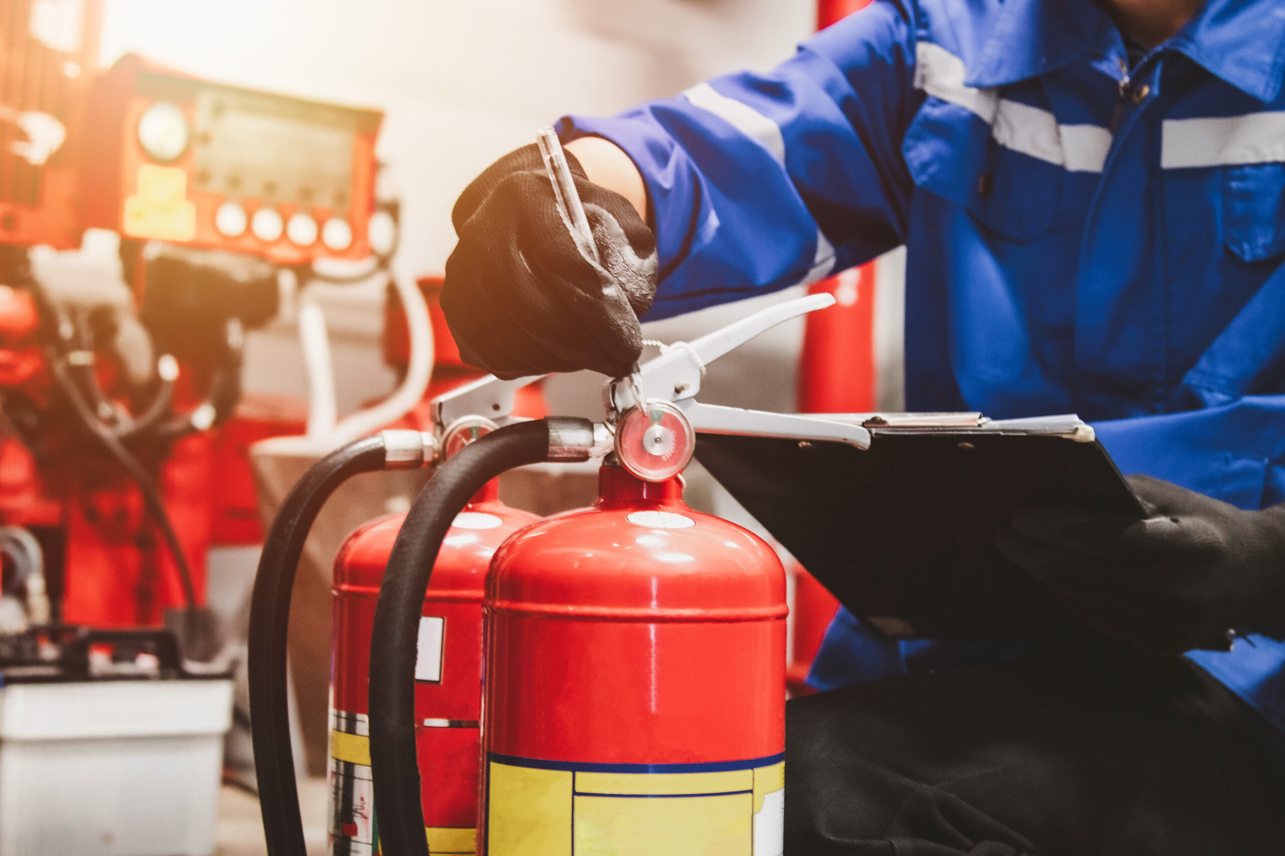 Engineer check fire suppression system,check fire extinguisher tank in the fire control room for safety
