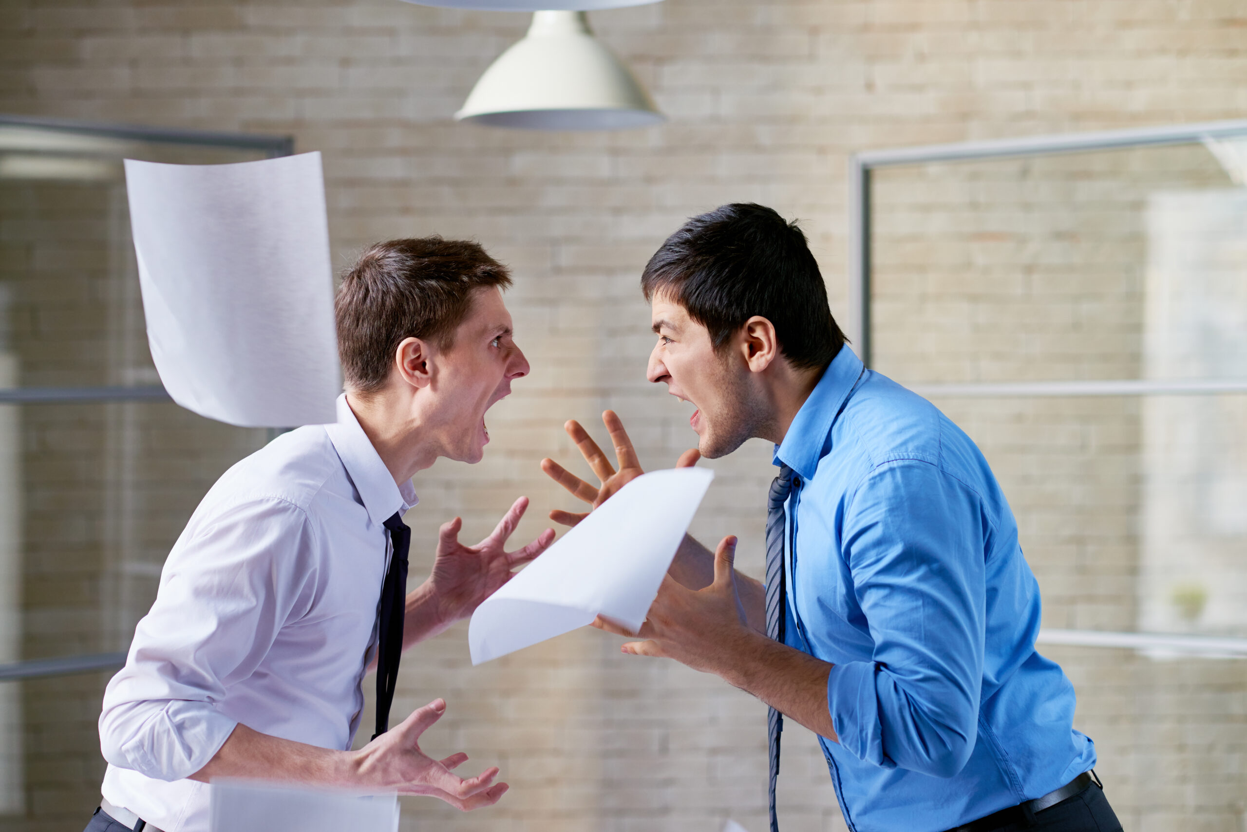 Furious businessmen shouting at each other, document flying around them